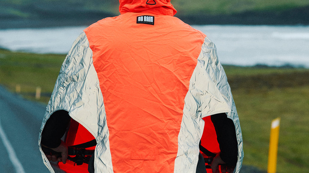 Cyclist riding through the rain with waterproof protection for legs and feet