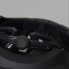 Black NoRain Bicycle helmet with a focus on the front design on a gray background