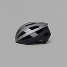 Silver and black NoRain Bicycle helmet on a gray background