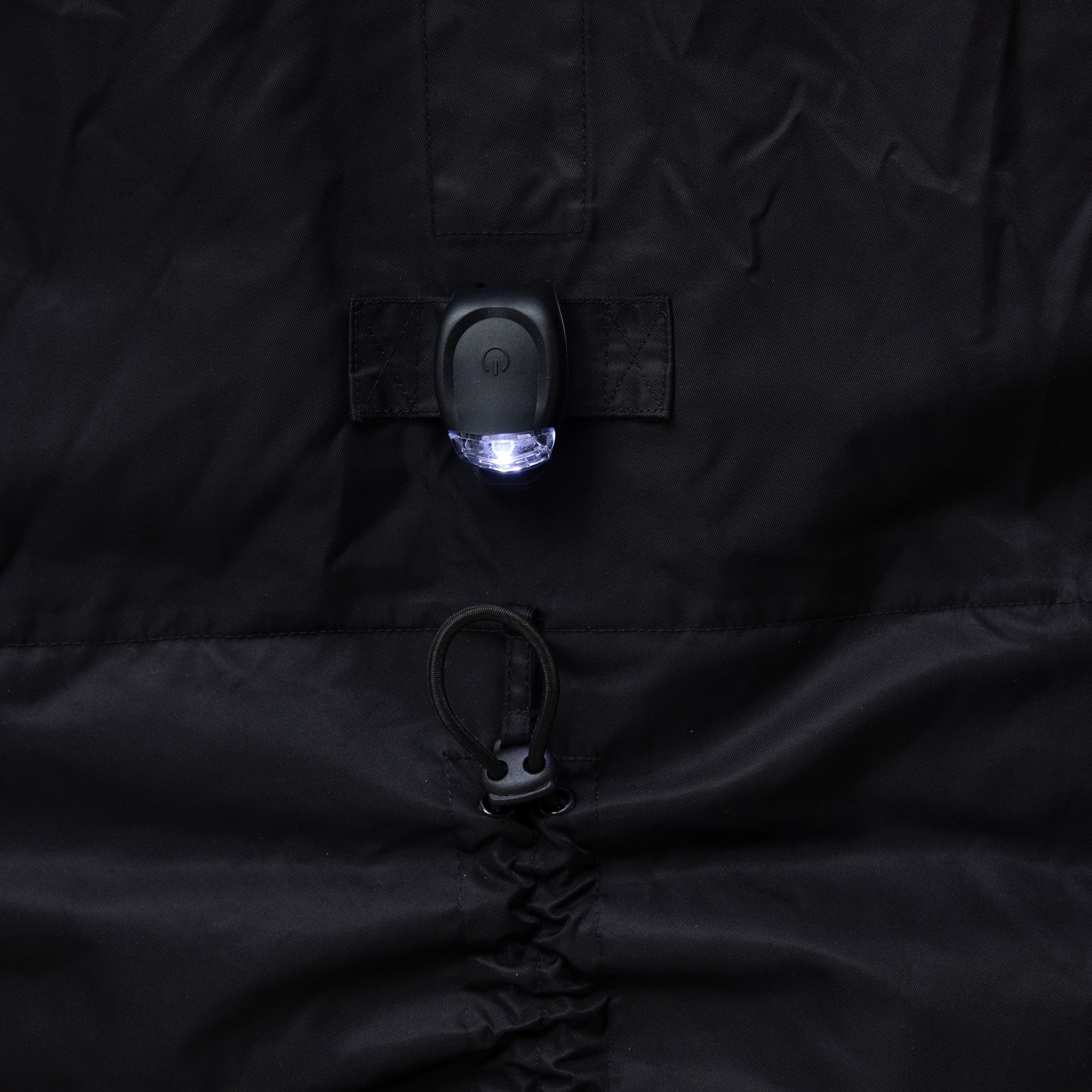 Close-up of a black NoRain Bicycle poncho with a light on the chest area.