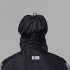 Black NoRain bicycle poncho with a hood on a gray background